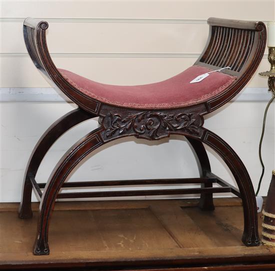 An Edwardian mahogany X-frame stool